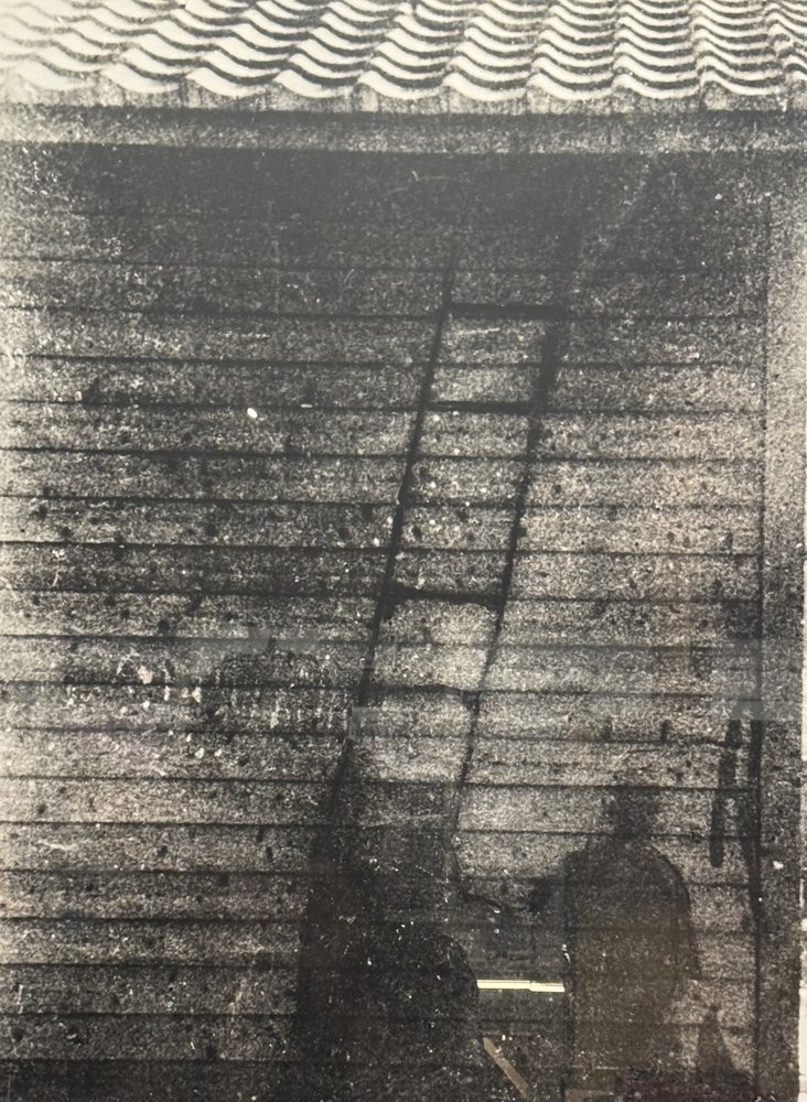 The silhouette of a lookout and his ladder.