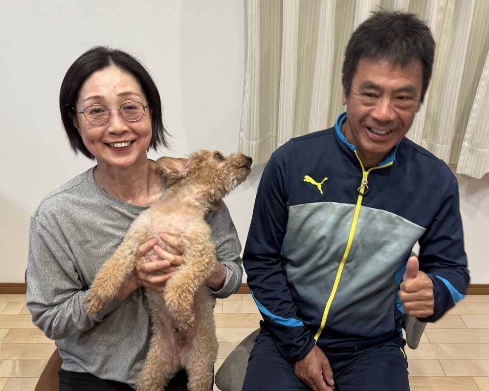 Junko and Yuji Miyazaki, proprietors of the Island Country Inn, with their toy poodle.